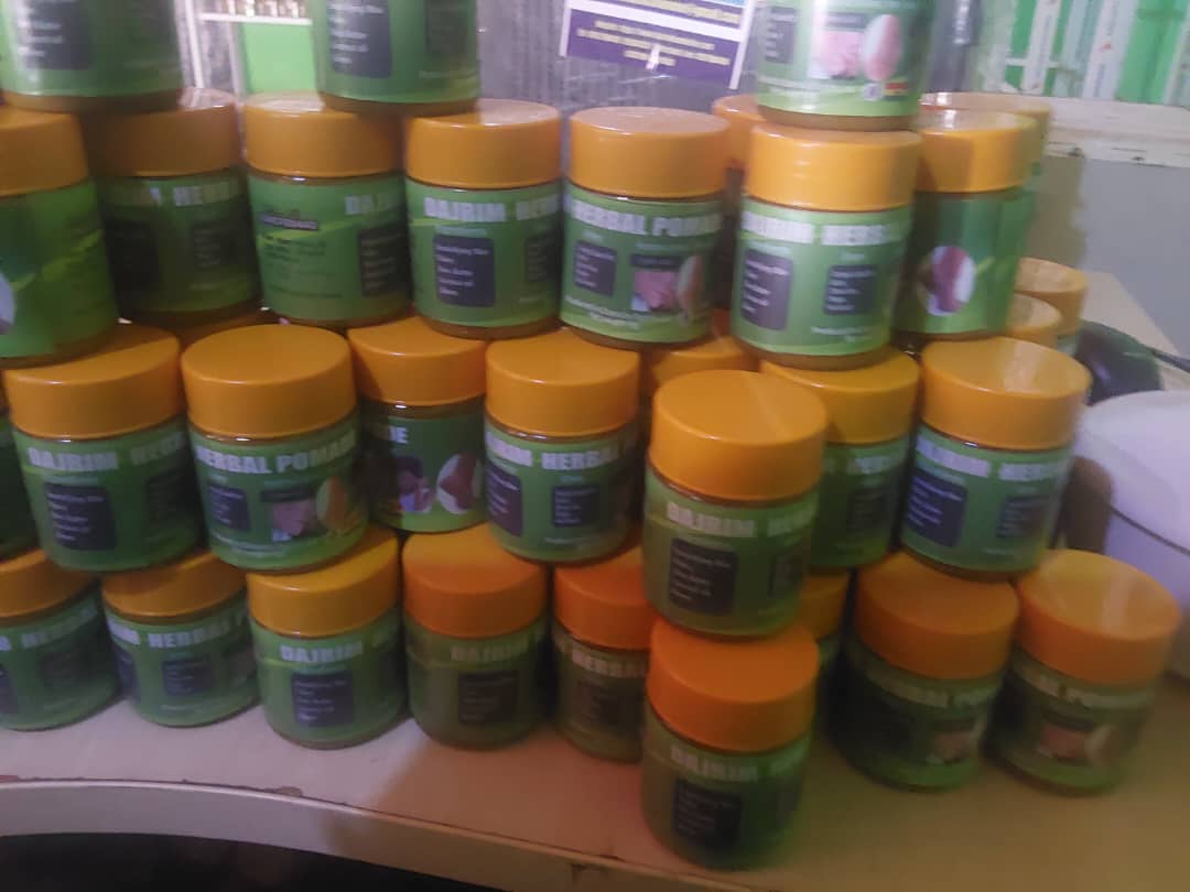 Shelves of herbal pomade jars