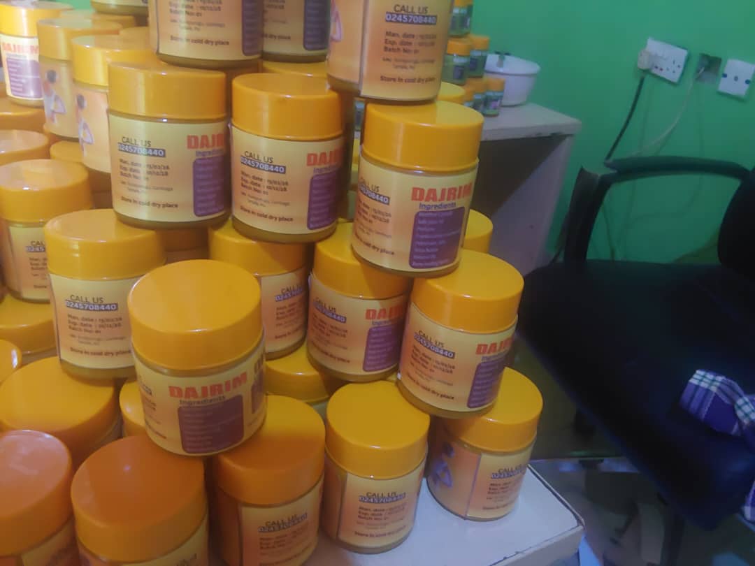 Yellow-labeled herbal pomade jars
